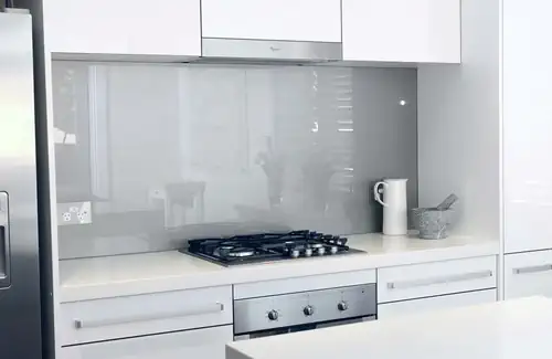 A grey coloured splashback installed into a residential kitchen